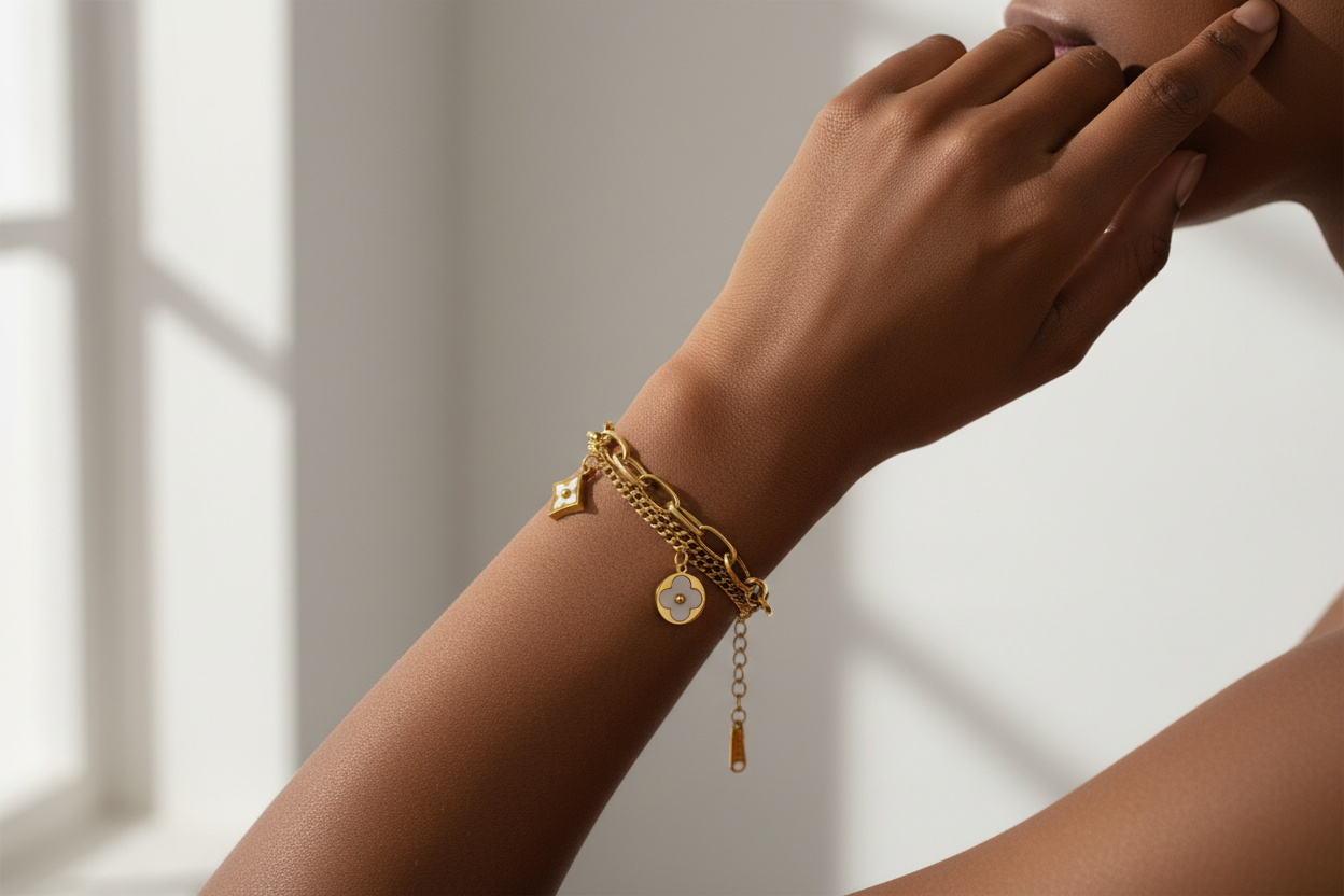 Model wearing gold charm bracelet - alternate pose