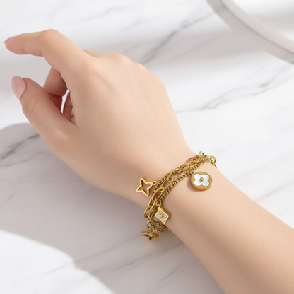 Model wearing gold charm bracelet